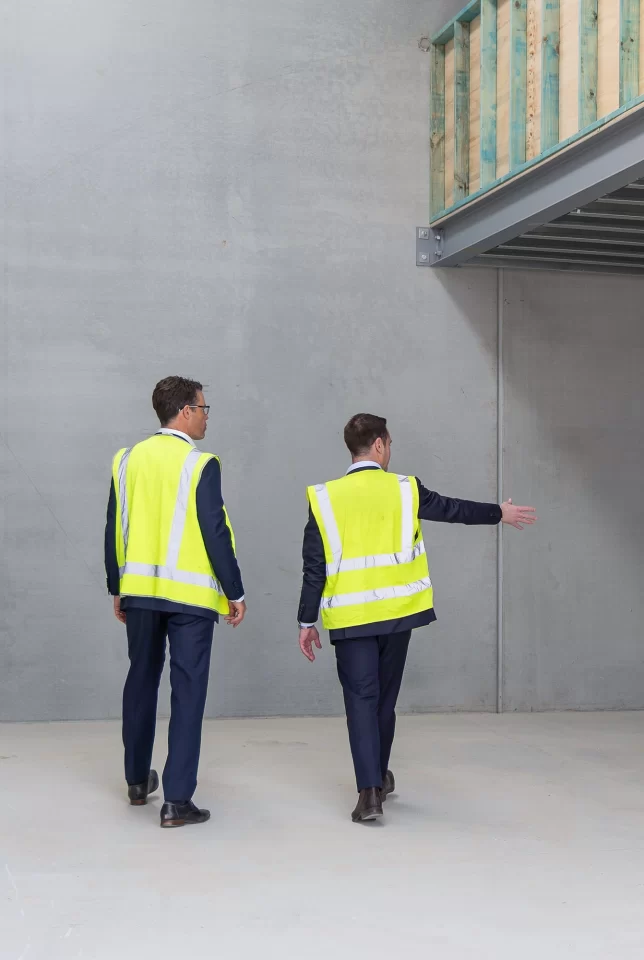 Civium agents walking through industrial warehouse